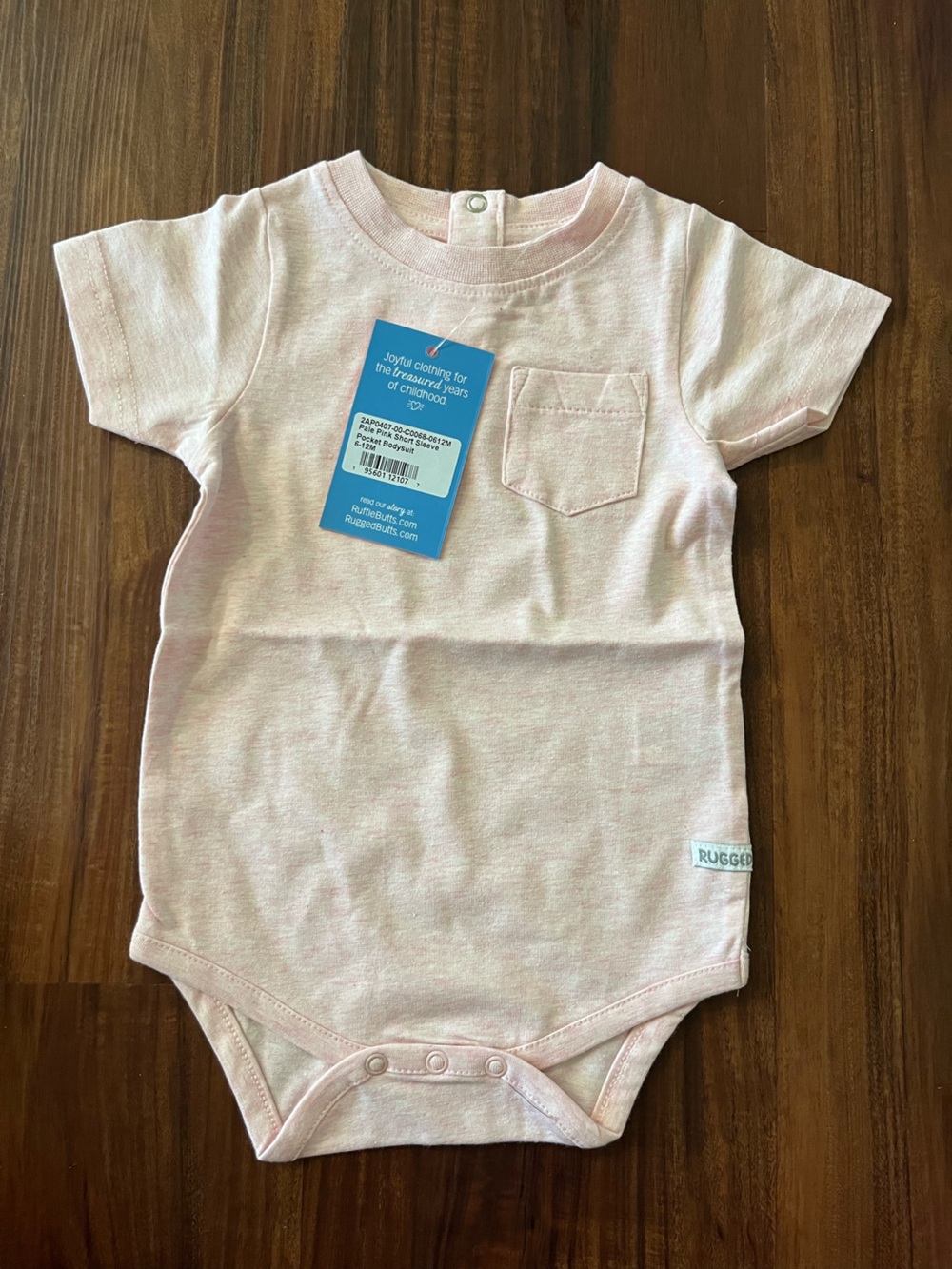 NWT RuggedButts Pale Pink Pocket Bodysuit 6-12m